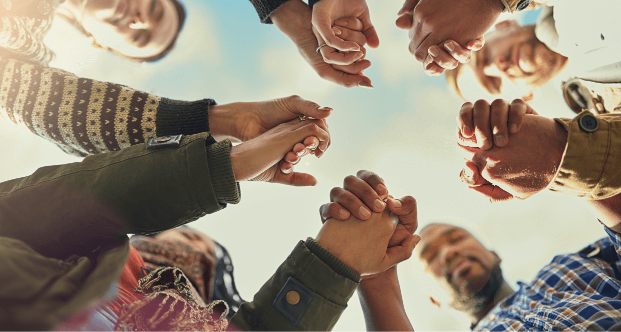 A group of people holding hands